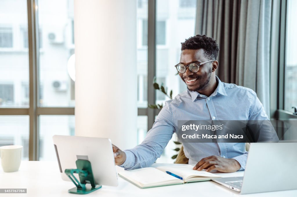 Businessman Using Technology Successful Businessman Using Technology In His Office High-Res Stock ...