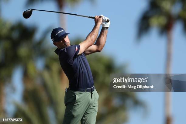 Jonathan Byrd of the United States hits his tee shot on the ninth hole during the first round of The American Express at PGA West Nicklaus Tournament...