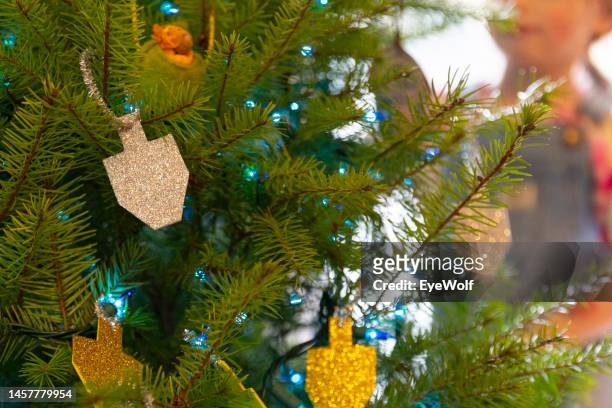 close up detail shot of home made hanukkah decorations hung up on a christmas / holiday tree - portland oregon christmas stock pictures, royalty-free photos & images