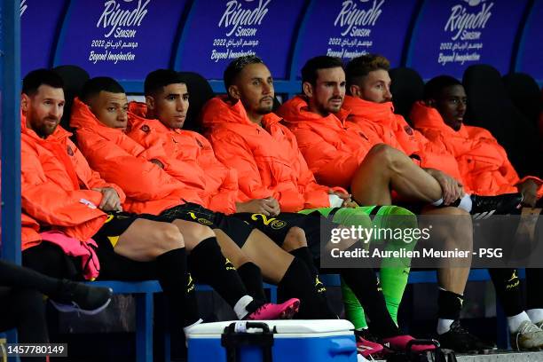 Leo Messi, Kylian Mbappe, Achraf Hakimi, Keylor Navas and Sergio Ramos of Paris Saint-Germain sit on the bench during the friendly match between...