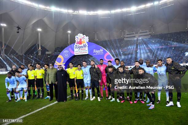 Both teams pose for a photo before the friendly match between Paris Saint-Germain and Riyadh XI at King Fahd International Stadium on January 19,...