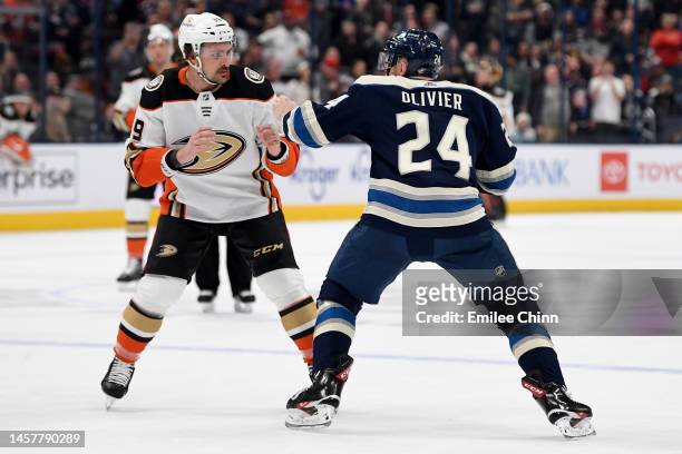 Mathieu Olivier of the Columbus Blue Jackets and Sam Carrick of the Anaheim Ducks fight during the first period at Nationwide Arena on January 19,...