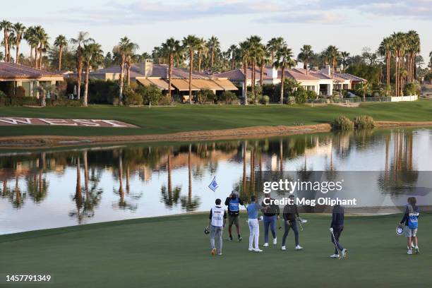 General view is seen as Ben Griffin of the United States and Tyson Alexander of the United States shake hands on the ninth green during the first...