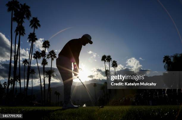 Jon Rahm of Spain prepares to play his tee shot on the 18th hole during the first round of The American Express at PGA West La Quinta Country Club on...