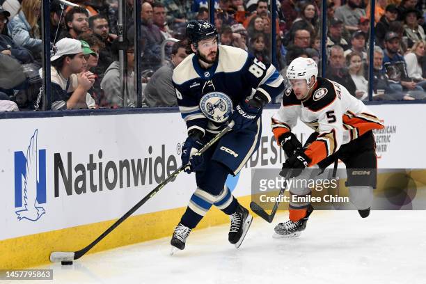 Kirill Marchenko of the Columbus Blue Jackets controls the puck against Urho Vaakanainen of the Anaheim Ducks during the second period at Nationwide...
