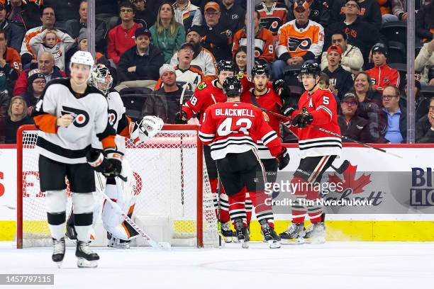 The Chicago Blackhawks celebrate a goal by Reese Johnson during the second period against the Philadelphia Flyers at Wells Fargo Center on January...