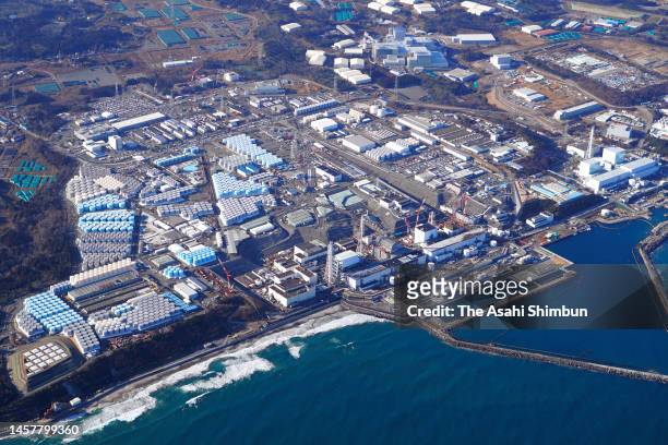 In this aerial image, damaged reactors and tanks store treated radioactive water are seen at Tokyo Electric Power Co 's Fukushima Daiichi Nuclear...