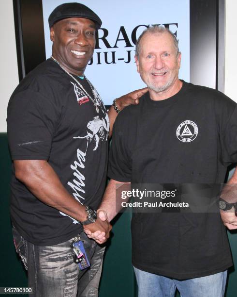 Actors Michael Clark Duncan and Ed O'Neil attend the Gracie Jiu-Jitsu Academy grand opening and ribbon cutting ceremony at Gracie Academy on June 5,...