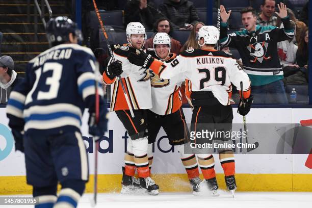 Max Jones of the Anaheim Ducks celebrates his goal with Isac Lundestrom and Dmitry Kulikov during the third period against the Columbus Blue Jackets...