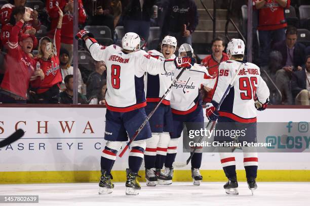 Alex Ovechkin, Dylan Strome, Dmitry Orlov and Nicolas Aube-Kubel of the Washington Capitals celebrate after Strome scored a goal against the Arizona...