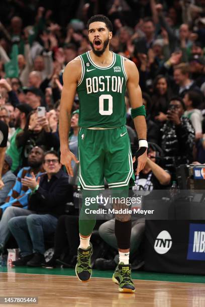 Jayson Tatum of the Boston Celtics celebrates after scoring against the Golden State Warriors during overtime at TD Garden on January 19, 2023 in...