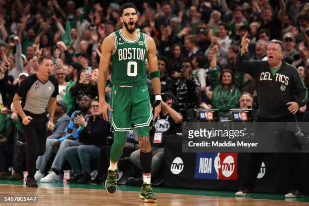 Jayson Tatum of the Boston Celtics celebrates after scoring against the Golden State Warriors during overtime at TD Garden on January 19, 2023 in...