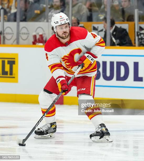 Rasmus Andersson of the Calgary Flames skates against the Nashville Predators during an NHL game at Bridgestone Arena on January 16, 2023 in...