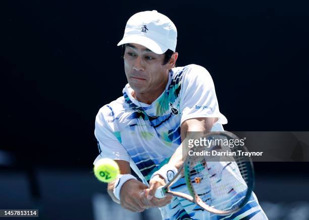 Mackenzie McDonald of the United States plays a backhand during the third round singles match against Yoshihito Nishioka of Japan during day five of...
