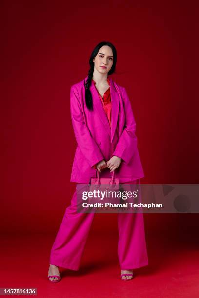 beautiful woman wearing pink suit - röd blazer bildbanksfoton och bilder