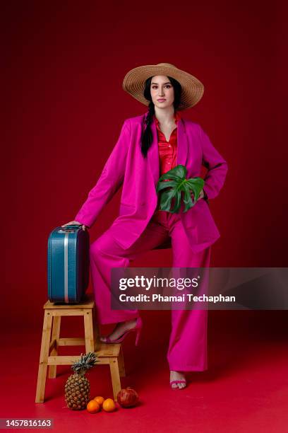 woman in pink suit - red and pink outfit stock pictures, royalty-free photos & images