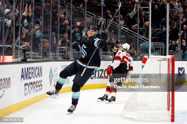 Andre Burakovsky of the Seattle Kraken celebrates his overtime goal against the New Jersey Devils to win 4-3 at Climate Pledge Arena on January 19,...