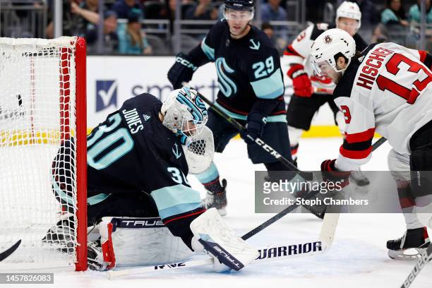 Nico Hischier of the New Jersey Devils scores past Martin Jones of the Seattle Kraken during the third period at Climate Pledge Arena on January 19,...