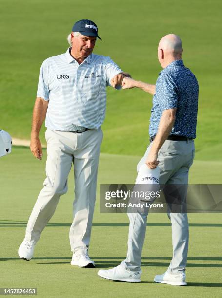 Fred Couples and Steve Flesch after the round on the 18th gree during the first round of the Mitsubishi Electric Championship at Hualalai at Hualalai...