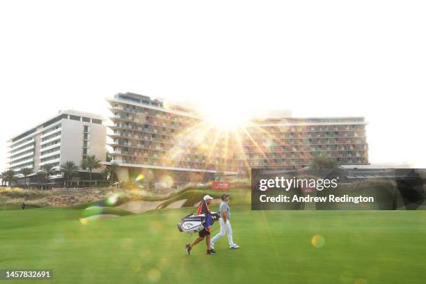 Francesco Molinari of Italy and his caddie Pello Iguaran walk on the twelfth hole during day two of the Abu Dhabi HSBC Championship at Yas Links Golf...