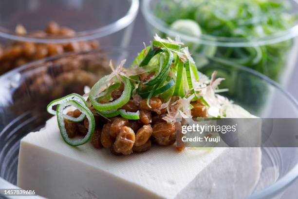 put natto on tofu. - natto stock pictures, royalty-free photos & images