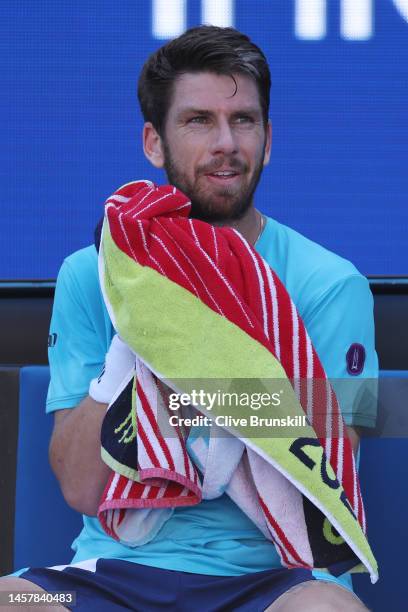 Cameron Norrie of Great Britain cools down during the third round singles match against Jiri Lehecka of the Czech Republic during day five of the...