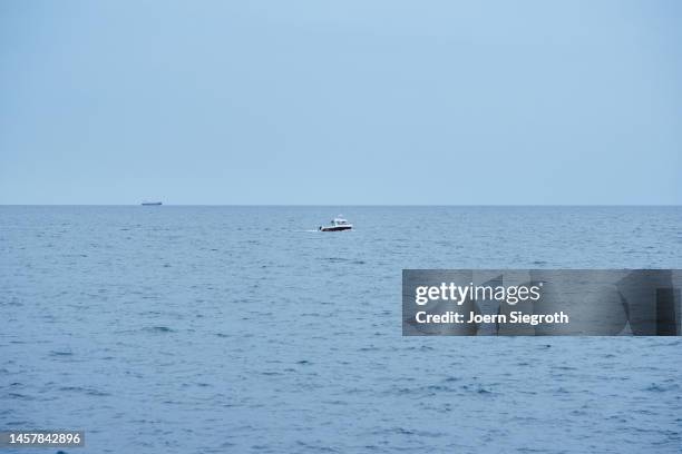 a boat/ship at sea - sporthandel stock-fotos und bilder