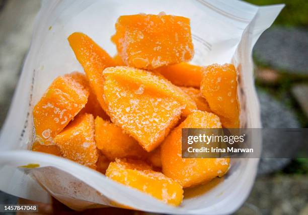 a bag of fozen mango - food bag stock pictures, royalty-free photos & images