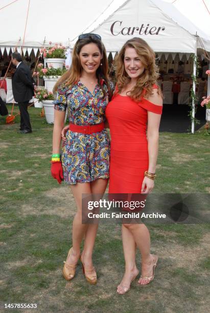 Model Kelly Brook and a guest attend the 24th annual Cartier International Polo in Great Windsor Park, England.