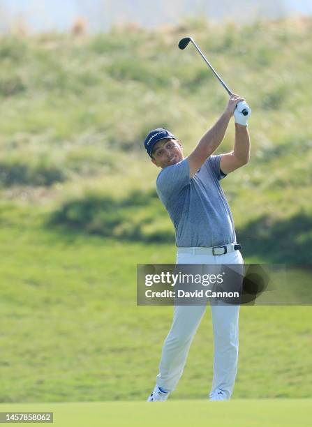 Francesco Molinari of Italy plays his second shot on the second hole during the second round on day two of the Abu Dhabi HSBC Championship at Yas...