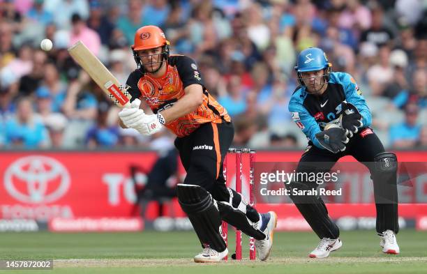 Aaron Hardie of the Scorchers and Alex Carey of the Strikers during the Men's Big Bash League match between the Adelaide Strikers and the Perth...