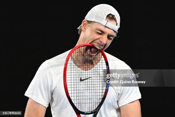 Denis Shapovalov of Canada bites his racquet during the third round singles match against Hubert Hurkacz of Poland during day five of the 2023...