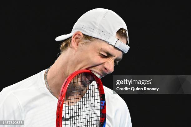 Denis Shapovalov of Canada bites his racquet during the third round singles match against Hubert Hurkacz of Poland during day five of the 2023...