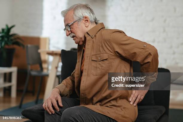 senior man suffering backache - disease prevention stock pictures, royalty-free photos & images