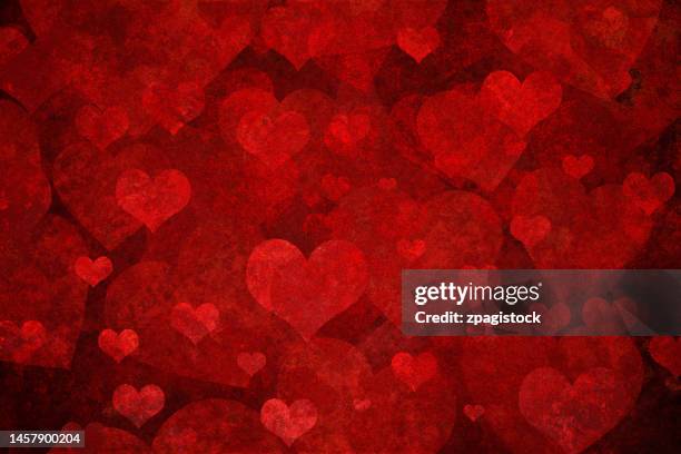 red grunge background with heart shapes - valentines day stockfoto's en -beelden