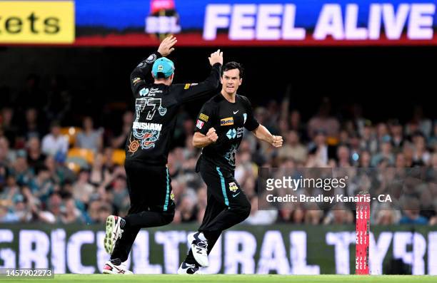 James Bazley of the Heat celebrates taking the wicket of Matthew Wade of the Hurricanes during the Men's Big Bash League match between the Brisbane...
