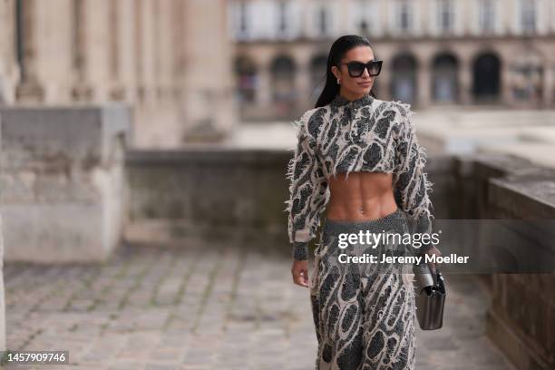Jessica Aidi Verratti seen wearing full Louis Vuitton Look, cropped white and grey fur pullover, white and grey wide fur pants, black Louis Vuitton...