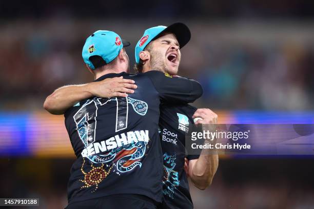 Sam Hain of the Heat celebrates after taking a catch to dismiss Mitchell Owen during the Men's Big Bash League match between the Brisbane Heat and...