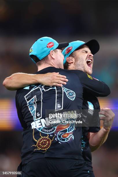 Sam Hain of the Heat celebrates after taking a catch to dismiss Mitchell Owen during the Men's Big Bash League match between the Brisbane Heat and...