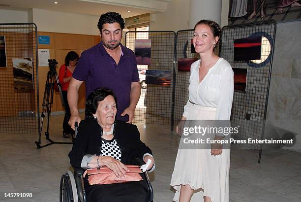Maria Esteve, her grandmother and her husband Antonio Garrido attend her picture exhibition 'De Malaga Al Cielo' on May 16, 2012 in Malaga, Spain.