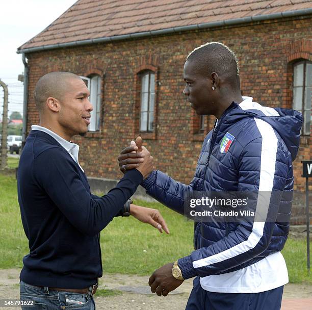 Nigel De Jong of Netherlands and Mario Balotelli greet each other during a visit by an Italian Football Association delegation to the...