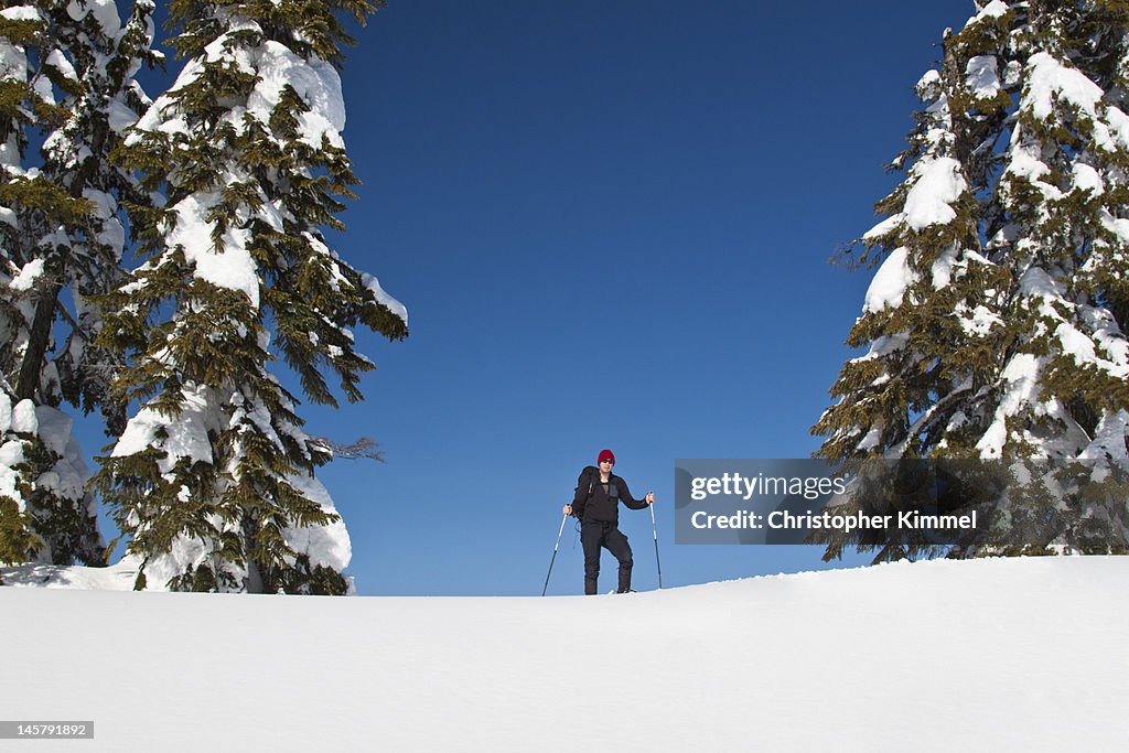 Hiker on snowy ridge