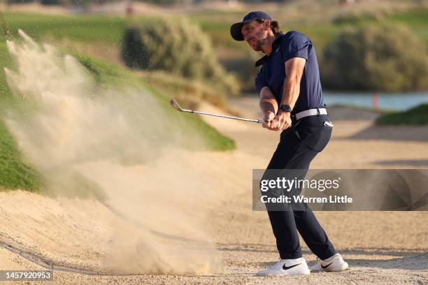 Tommy Fleetwood of England plays a bunker shot on the eighteenth hole during day two of the Abu Dhabi HSBC Championship at Yas Links Golf Course on...