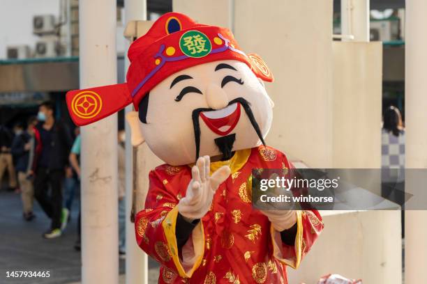 chinese new year in hong kong - god of wealth stock pictures, royalty-free photos & images