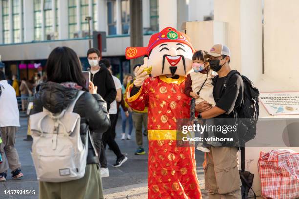 chinese new year in hong kong - god of wealth stock pictures, royalty-free photos & images