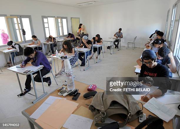 Tunisian students take the baccalaureat exam on June 6, 2012 in Tunis. Some 129 181 candidates registered for the main session of the baccalaureat...
