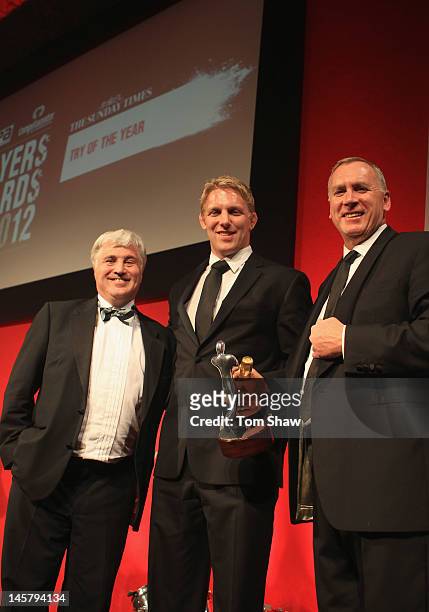 Josh Lewsey formerly of Bath poses with the Sunday Times Try of the Year Award he accepted on behalf of Michael Claassens of Bath with Stuart Barnes...