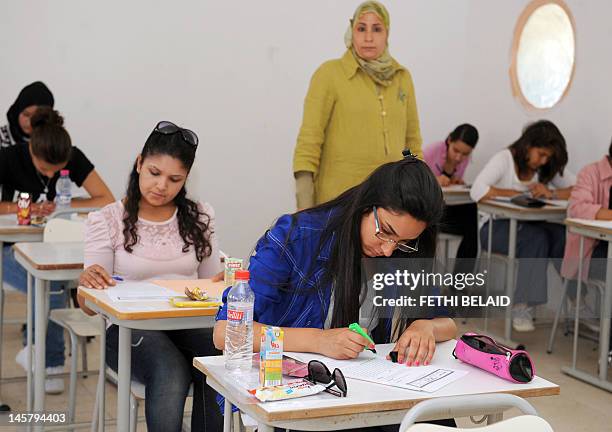 Tunisian students take the baccalaureat exam on June 6, 2012 in Tunis. Some 129 181 candidates registered for the main session of the baccalaureat...