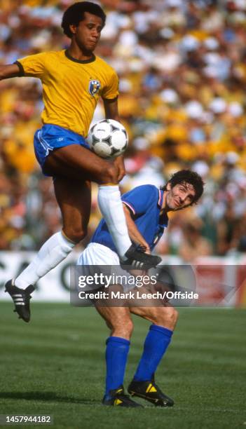 July 1982, Barcelona - FIFA World Cup - Italy v Brazil - Luisinho of Brazil and Paolo Rossi of Italy.