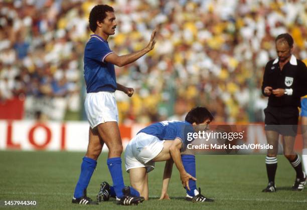 July 1982, Barcelona - FIFA World Cup - Italy v Brazil - Giuseppe Bergomi of Italy and Giampiero Marini of Italy holding his injured leg.